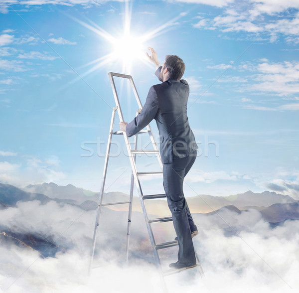 Young businessman on the top of his career Stock photo © konradbak