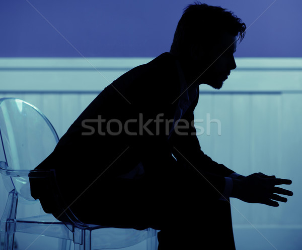 Sigouette of man sitting on the chair Stock photo © konradbak