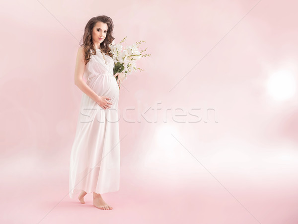 Fiatal terhes tart virágcsokor vadvirágok köteg Stock fotó © konradbak