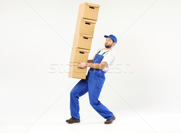 Young builder carrying a few boxes Stock photo © konradbak