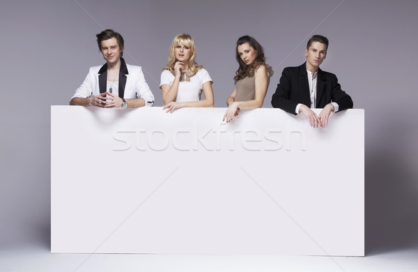 Four fashionable friends taking a photo Stock photo © konradbak