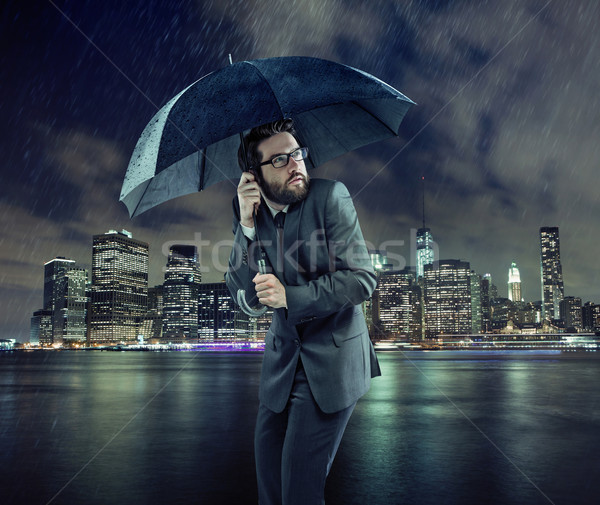 Afraid businessman in the rain Stock photo © konradbak