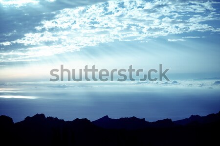 Pretty view of the sun beams among the clouds Stock photo © konradbak