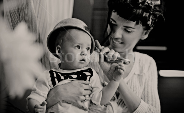 Beauty woman and baby with saucepan Stock photo © konradbak