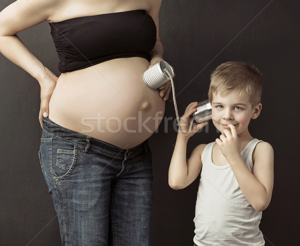 Kicsi fiú beszél testvér férfi telefon Stock fotó © konradbak