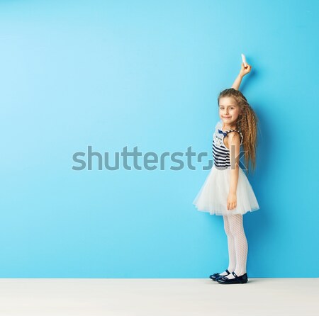 Little girl drawing a world map Stock photo © konradbak