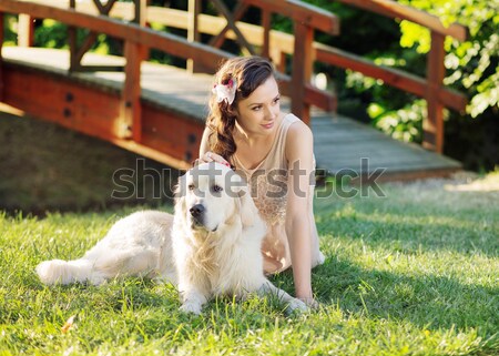Smiling woman with dog Stock photo © konradbak