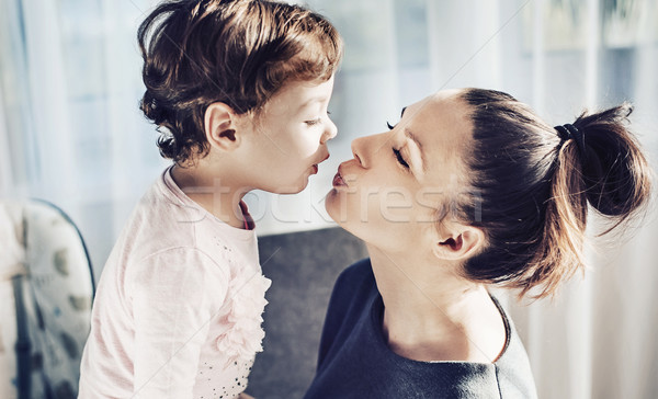 Portrait mère baiser bien-aimée enfant fille [[stock_photo]] © konradbak