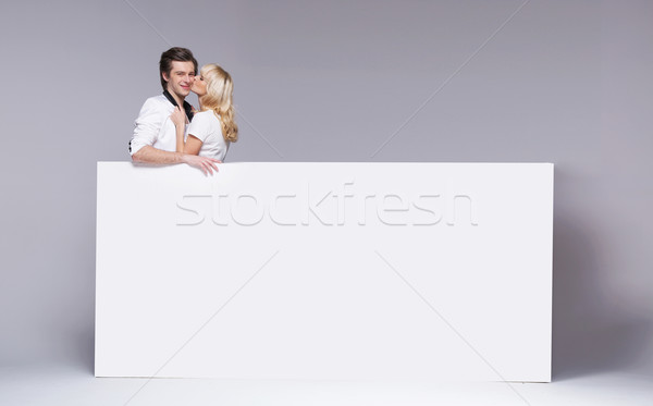Lucky guy hugged by his beloved girlfriend Stock photo © konradbak