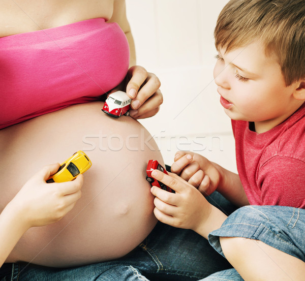 Family playing with the unborn sibling Stock photo © konradbak
