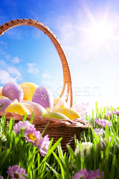 art Easter basket with Easter eggs on spring lawn Stock photo © Konstanttin