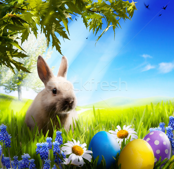 art Little Easter bunny and Easter eggs on green grass Stock photo © Konstanttin