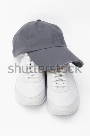 Running shoes and baseball cap Stock photo © kravcs