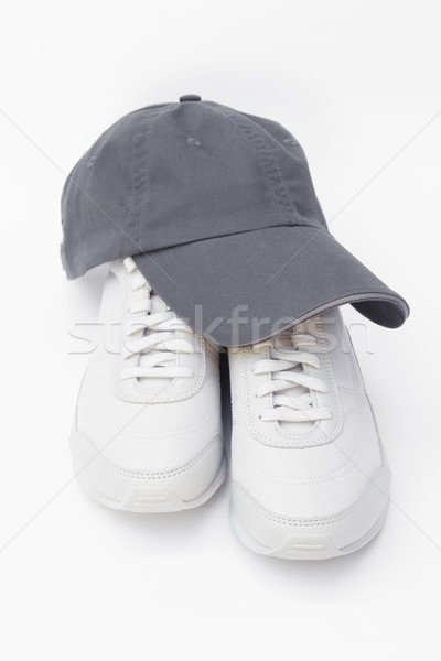 Running shoes and baseball cap Stock photo © kravcs