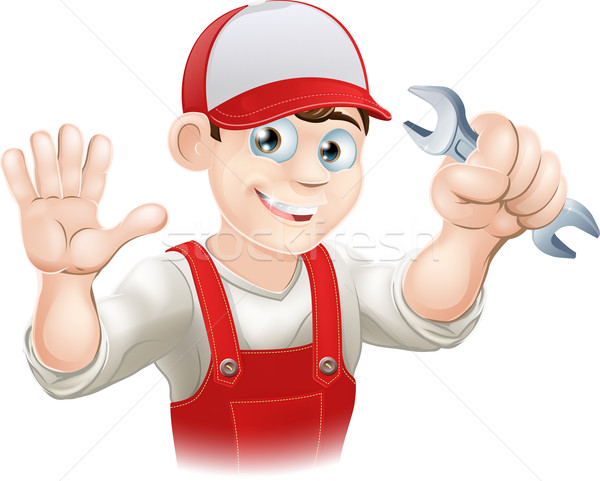Happy plumber or mechanic with spanner Stock photo © Krisdog