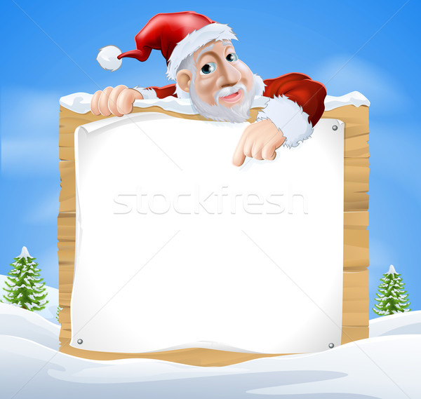 Kerstman teken winterlandschap cartoon wijzend Stockfoto © Krisdog