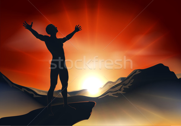Man on mountaintop with arms out Stock photo © Krisdog