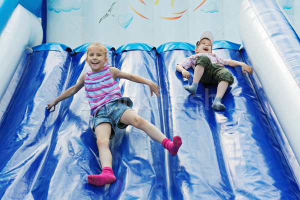 Crianças jogar alegre inflável família sorrir Foto stock © krugloff
