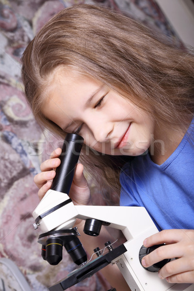 Fille regarder microscope école laboratoire étude [[stock_photo]] © krugloff