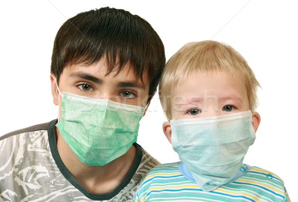 Enfants médicaux masques triste malade frères Photo stock © krugloff