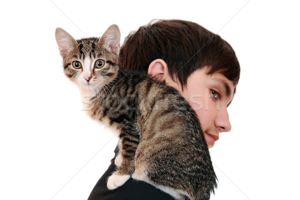 Teenager with a kitten (focus on the animal) Stock photo © krugloff