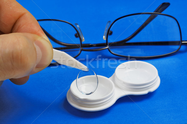 Removing the soft contact lens from the storage case Stock photo © krugloff
