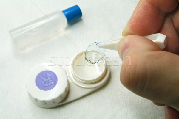 Careful handling of soft contact lenses  Stock photo © krugloff