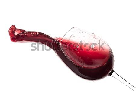 red wine splashing out of a glass, isolated on white Stock photo © kubais