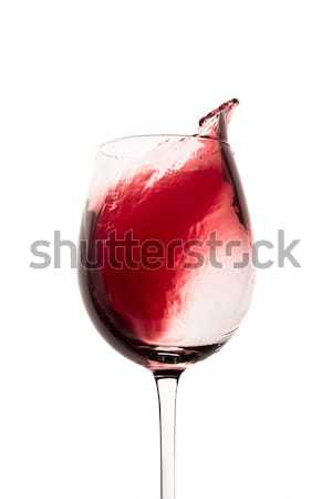 red wine splashing out of a glass, isolated on white Stock photo © kubais