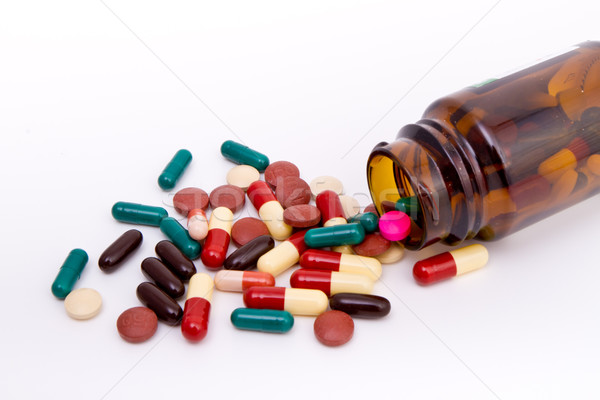 Kapseln farbenreich Glas Container medizinischen Hintergrund Stock foto © kubais