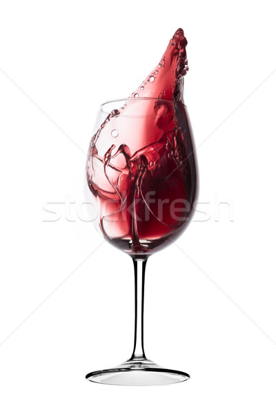 red wine splashing out of a glass, isolated on white Stock photo © kubais