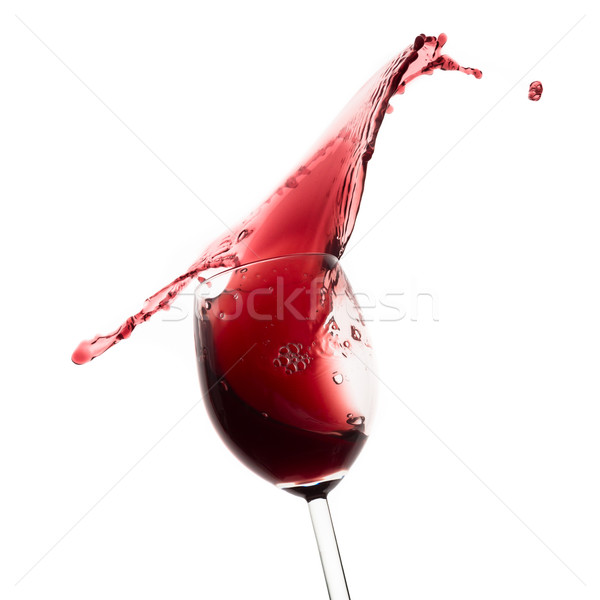 red wine splashing out of a glass, isolated on white Stock photo © kubais