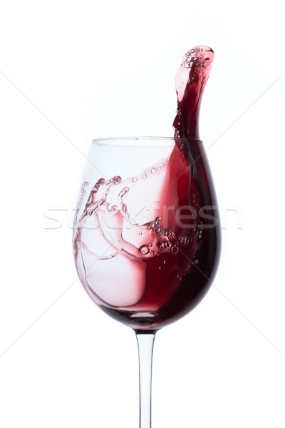 red wine splashing out of a glass, isolated on white Stock photo © kubais