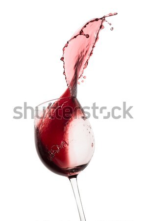 red wine splashing out of a glass, isolated on white Stock photo © kubais