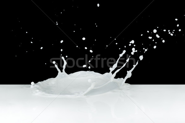 Melk splash geïsoleerd zwarte verf Stockfoto © kubais