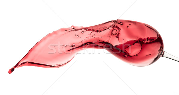 red wine splashing out of a glass, isolated on white Stock photo © kubais