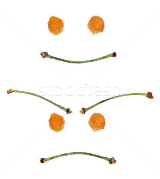 happy and angry face made ​​from stalks of sweet cherries an Stock photo © kuligssen