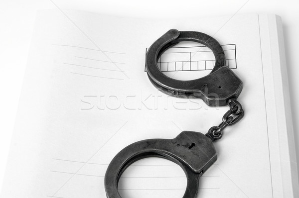 Menottes cas fichier métal police crime Photo stock © kuligssen