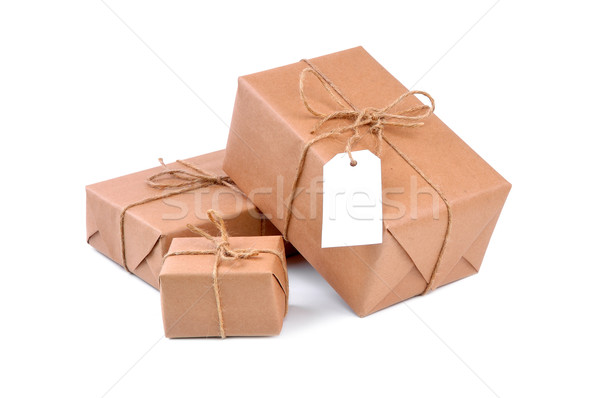 Três marrom pacotes branco conselho postar Foto stock © kuligssen
