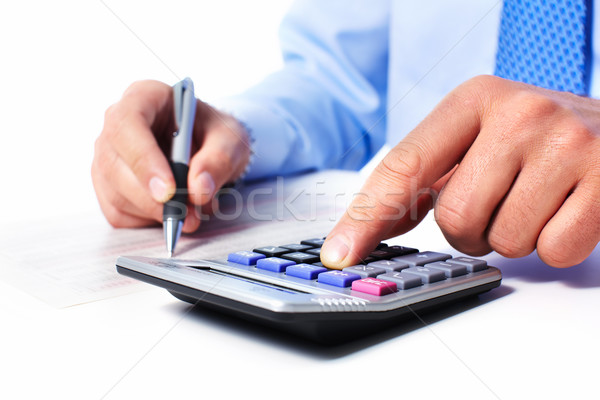 Hand with calculator. Stock photo © Kurhan