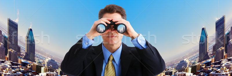 Empresario hombre de negocios binoculares mirando ciudad negocios Foto stock © Kurhan