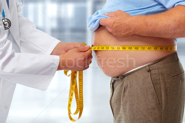 Lekarza otyły człowiek żołądka talia Zdjęcia stock © Kurhan