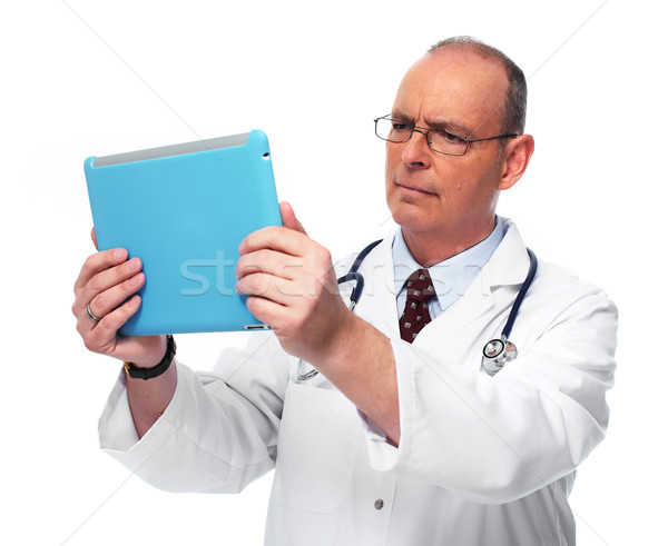 Mature medical doctor man with tablet computer. Stock photo © Kurhan