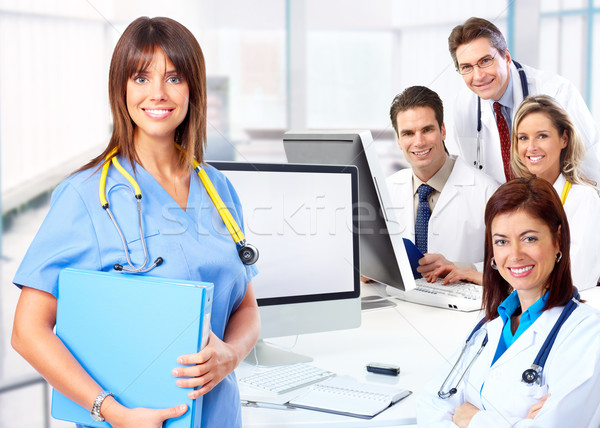 Medycznych lekarzy uśmiechnięty pracy komputera działalności Zdjęcia stock © Kurhan