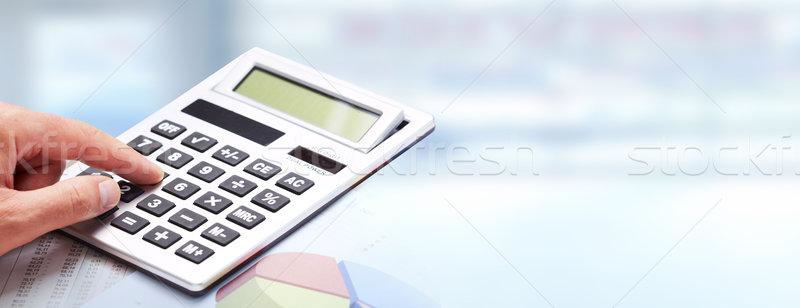 Mão calculadora azul escritório contabilidade trabalhar Foto stock © Kurhan