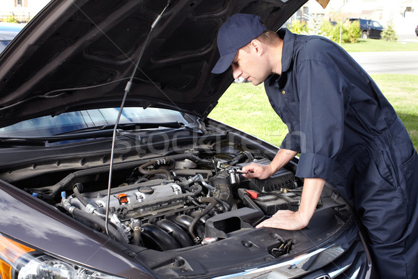 Stock photo: Car mechanic working in auto repair service.