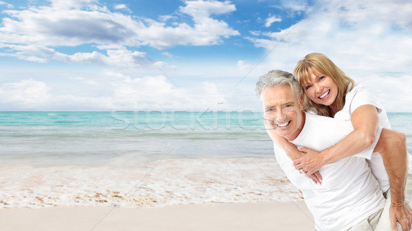 Boldog idős pár tengerpart egzotikus luxus üdülőhely Stock fotó © Kurhan