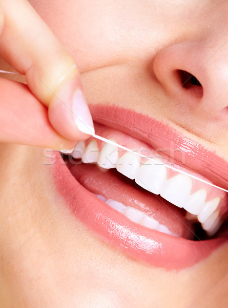 Mooie vrouw glimlach tandheelkundige gezondheidszorg kliniek gezicht Stockfoto © Kurhan