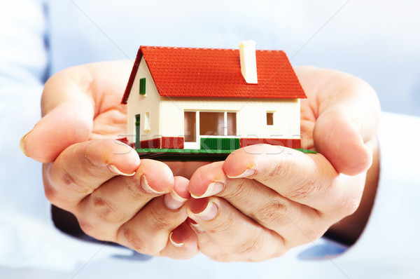 Hands with little house. Stock photo © Kurhan