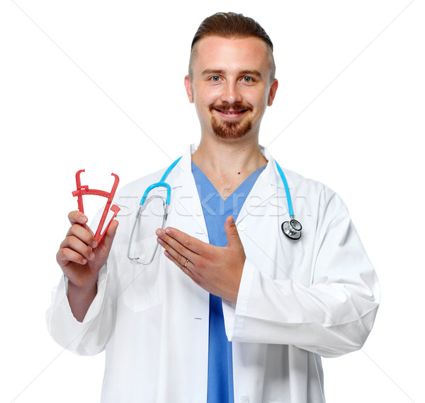 Doctor with body fat calipers. Stock photo © Kurhan